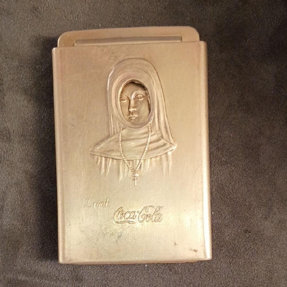 1915 Coca-Cola Metallic Gold Embossed Nun Ciger Cutter Belt Buckle